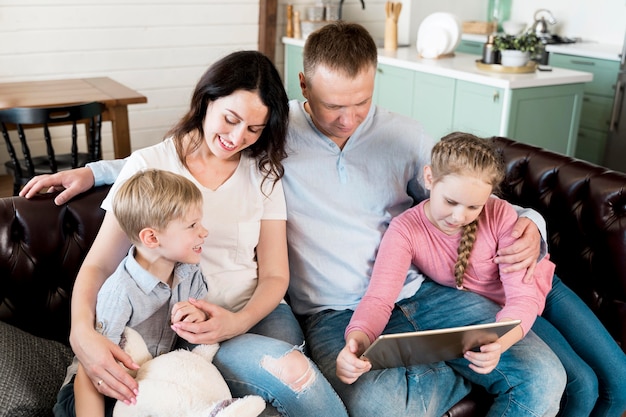 High angle happy family with device