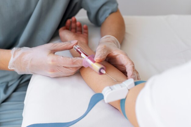 high angle healthcare professional drawing blood