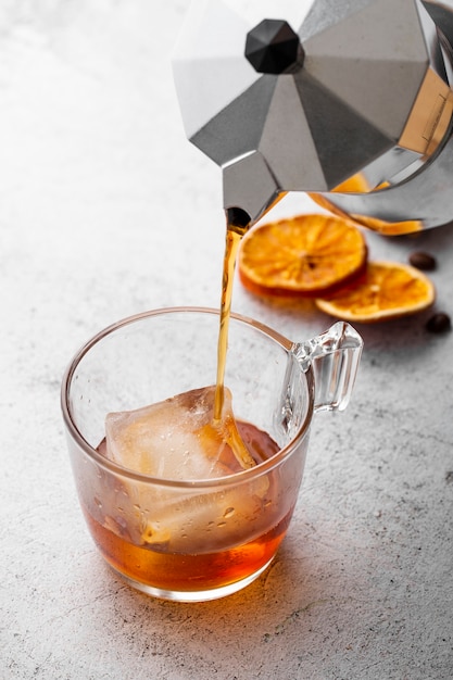 High angle hot beverage poured in glass