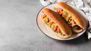 Free photo high angle hot-dogs on plate with copy-space