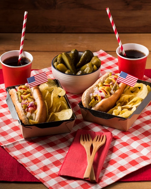 High angle hot-dogs with chips and pickles