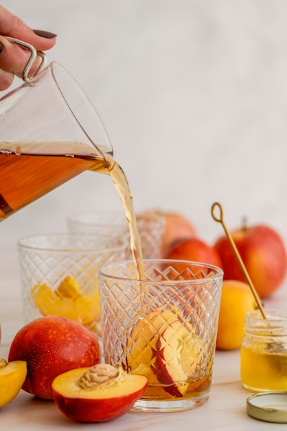 High angle ice tea glass with peach