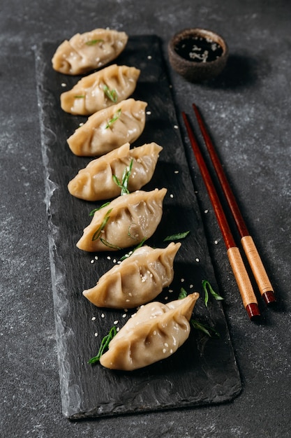 Free photo high angle japanese dumplings arrangement