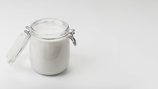 High angle jar with fresh milk and copy space