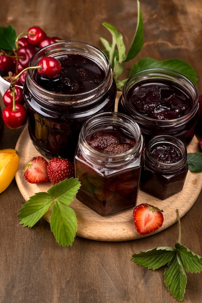 Free photo high angle jars with stewed fruit