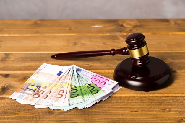 High angle judge gavel with euro banknotes