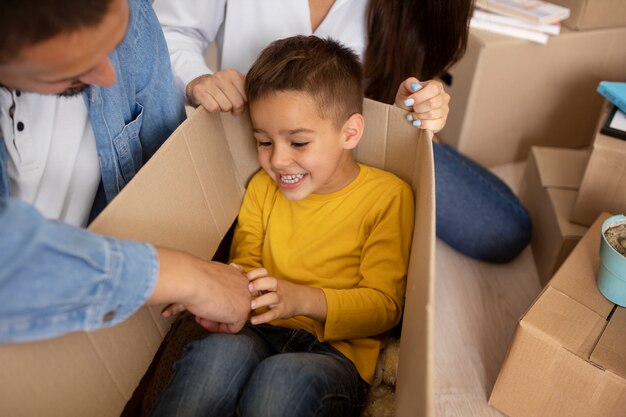 High angle kid laying in box