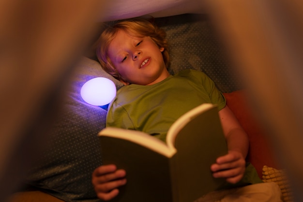 High angle kid spending time at home