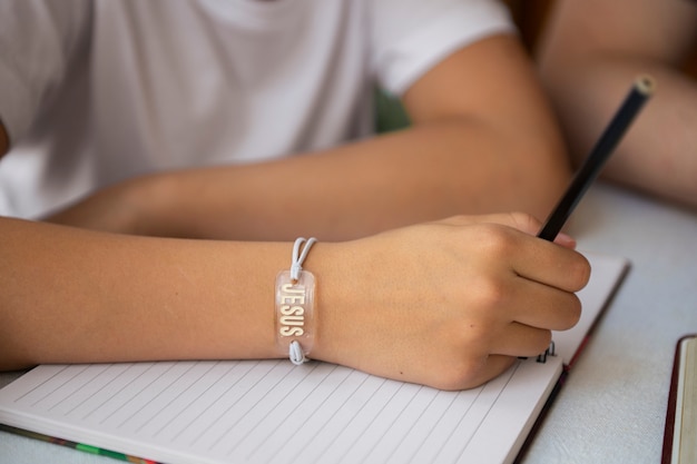 Free photo high angle kid wearing bracelet