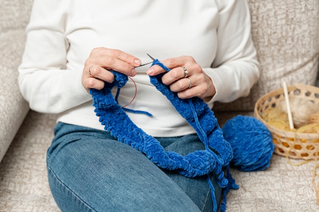 Free photo high angle knitting with senior female
