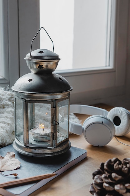 High angle lamp with candle and headphones