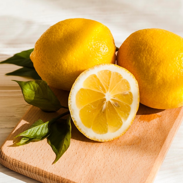 High angle lemons on wooden board