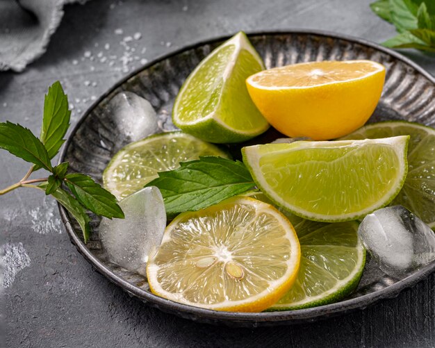 High angle lime and lemon slices on plate