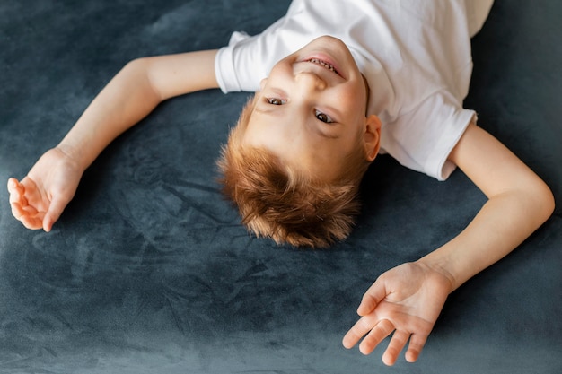 High angle little boy having fun at home