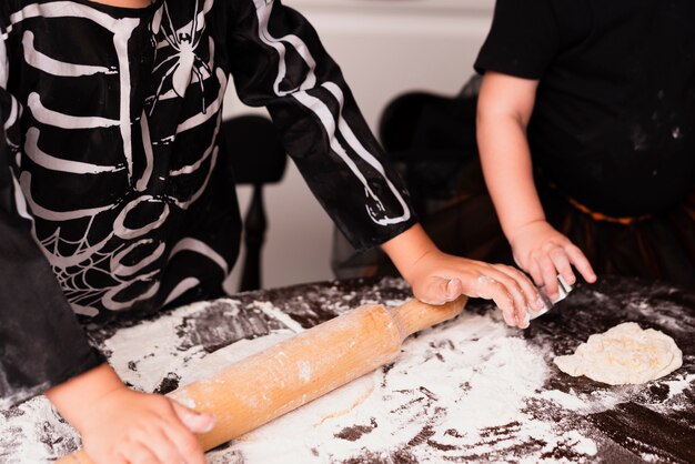 High angle of little boy making cookies