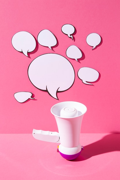 Free photo high angle loudspeaker and speech bubbles