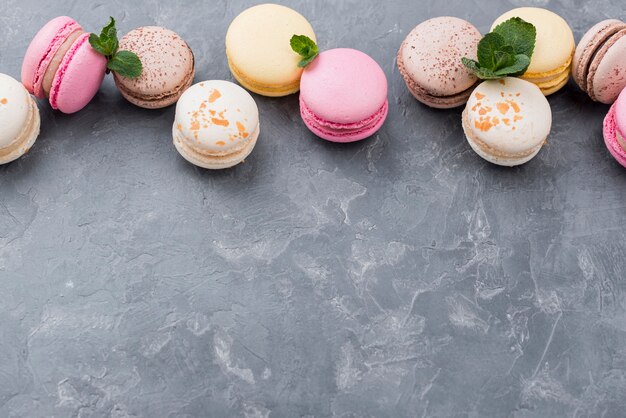 High angle of macarons with mint and copy space