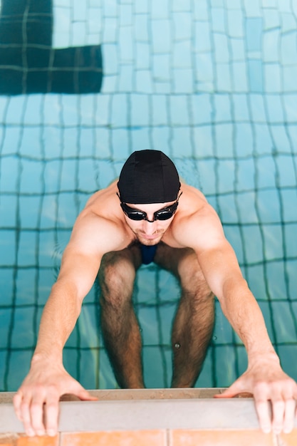 High angle male swimmer in ready position