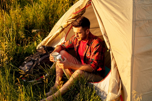 High angle man camping