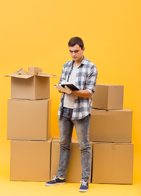 High angle man checking packages