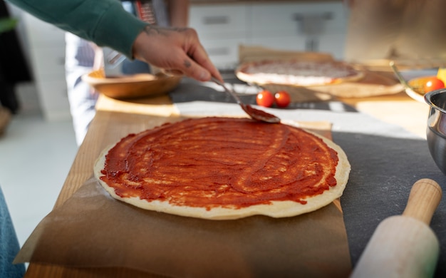 High angle man cooking delicious pizza