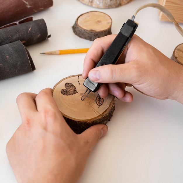 High angle man crafting in wood