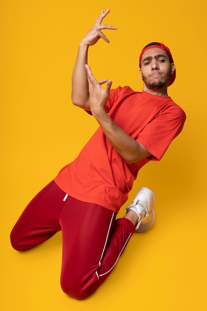 High angle man dancing in studio