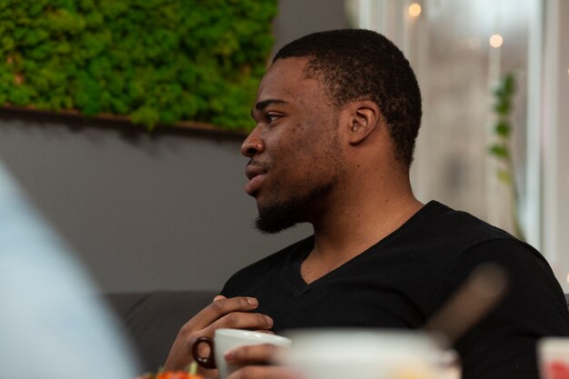 Free photo high angle man drinking coffee