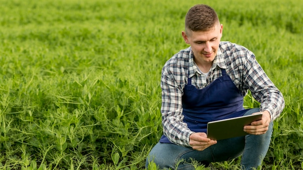 High angle man at farm with tablet