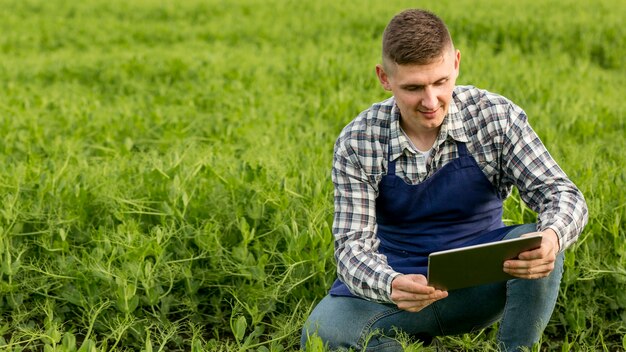 High angle man at farm with tablet