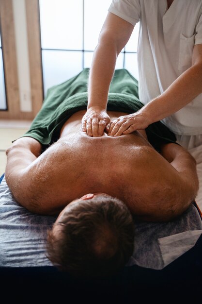 High angle man getting massage