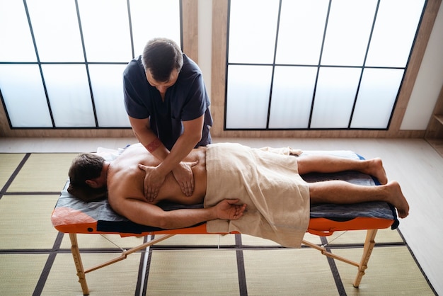 High angle man getting massage