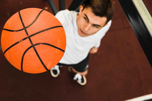 High angle man holding basketball