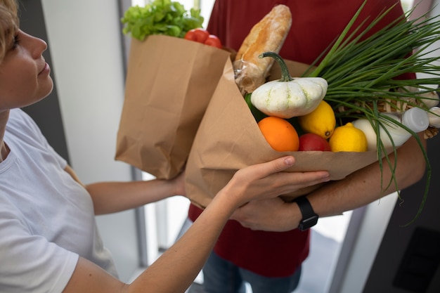 High angle man holding groceries