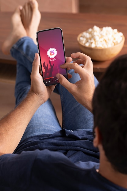 High angle man holding smartphone