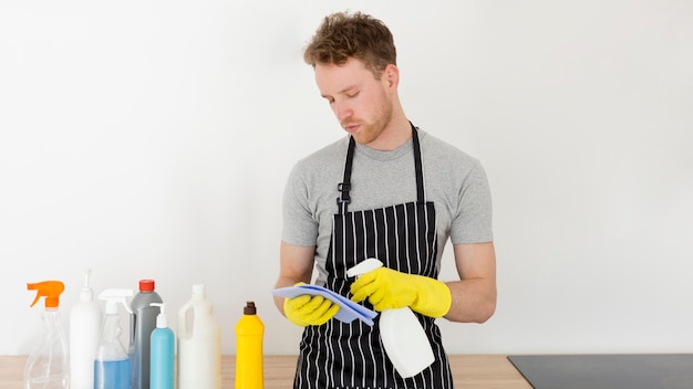 High angle man at home cleaning