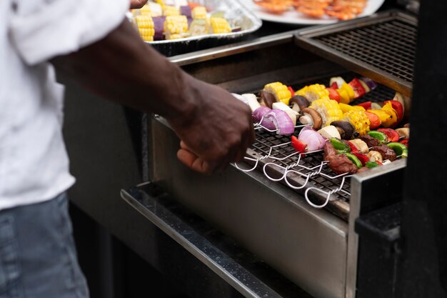 High angle man making barbecue