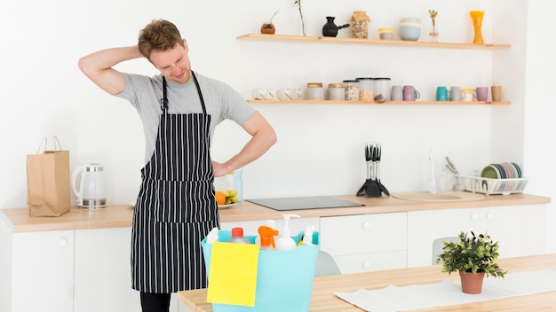 Free photo high angle man tired from cleaning house