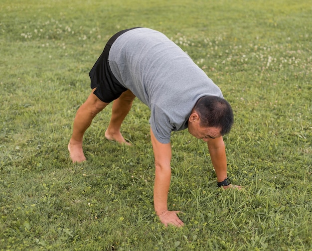 High angle man training on grass