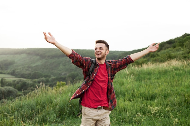 Free photo high angle man with arms raised