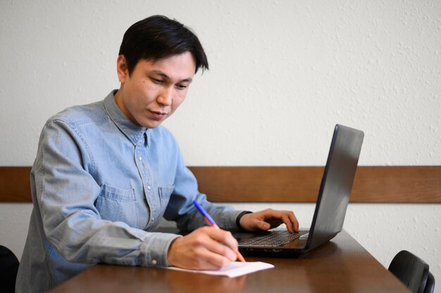 High angle man with laptop