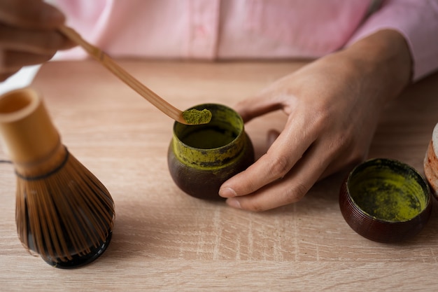 Free photo high angle man with matcha tea