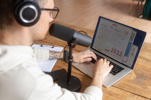 High angle man with podcast equipment