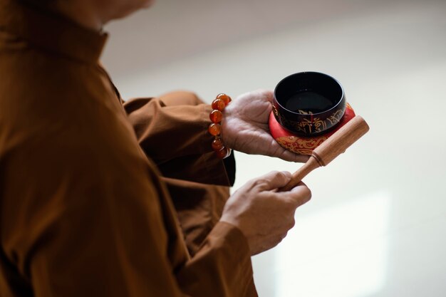 High angle of man with singing bowls