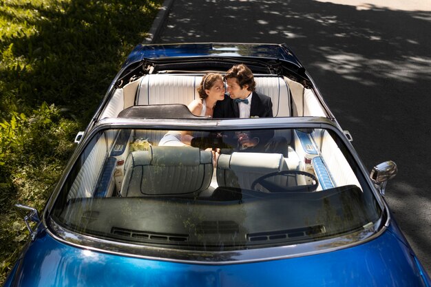 High angle married couple in car