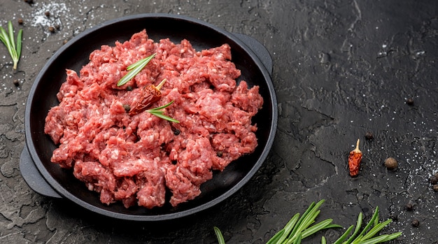 High angle of meat on plate with herbs