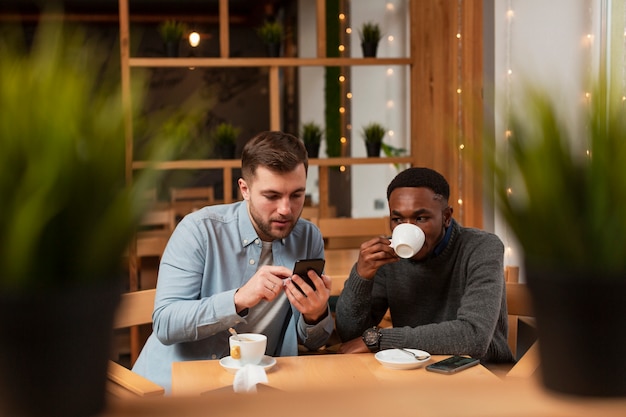 High angle men drinking coffee