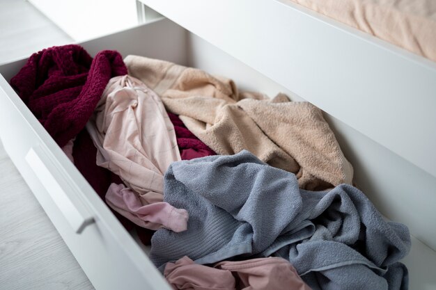 High angle messy drawer with clothes