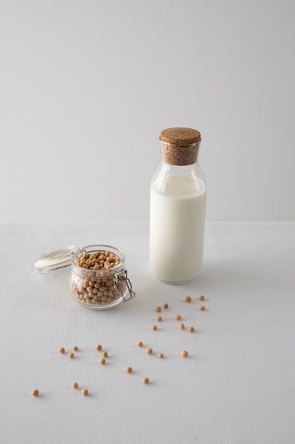 High angle milk bottle and chickpeas arrangement