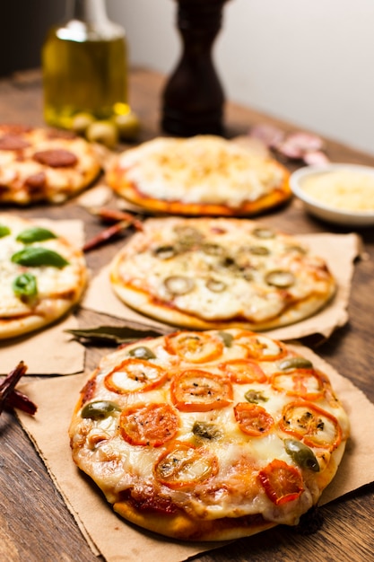 High angle of mini pizza on wood table